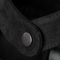 Close-up of the Diva jacket's snap-tab collar in soft Italian technical suede, showcasing the breathable fabric texture