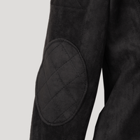 Close-up of the Diva jacket's quilted elbow patch, highlighting the soft texture and precision stitching of the technical suede